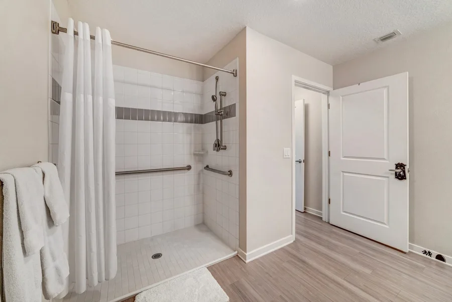 Walk-in shower with grab bars