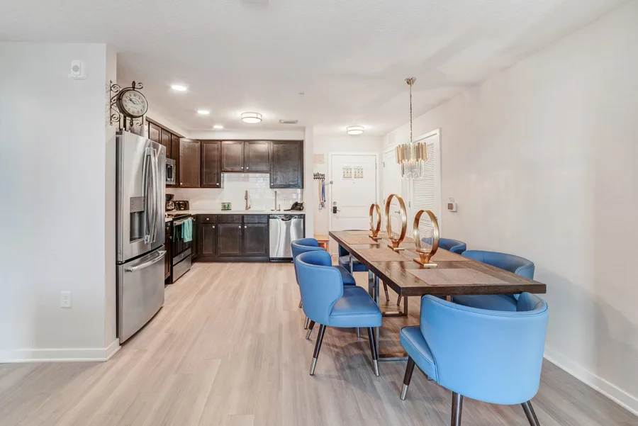 Dining table and kitchen beyond