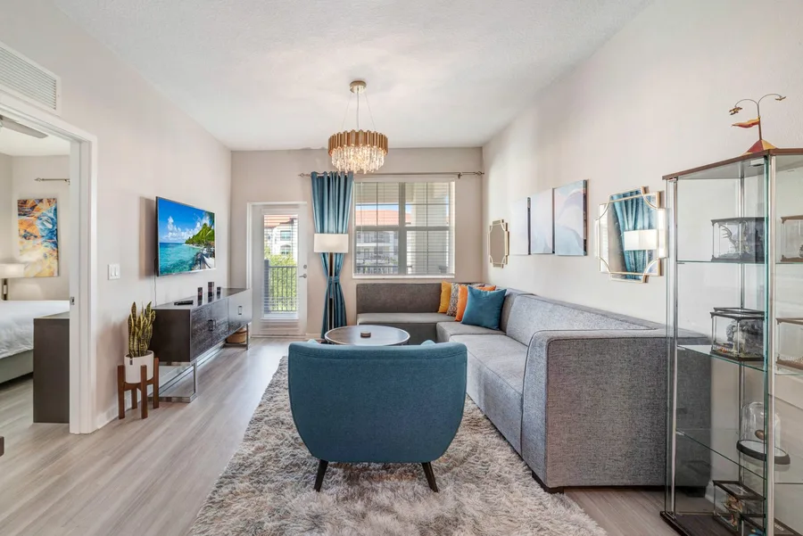 Living room with blue sofa and TV